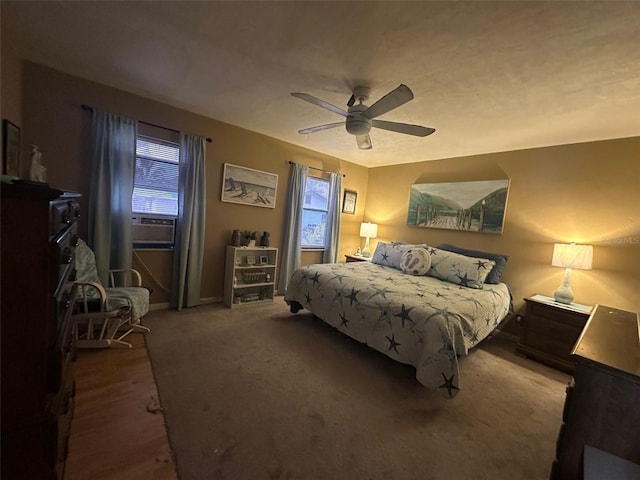 bedroom with carpet floors, cooling unit, and ceiling fan