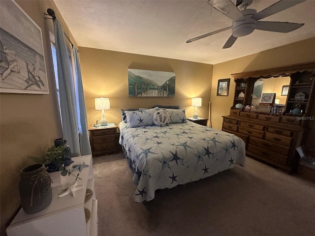 bedroom featuring dark carpet and ceiling fan