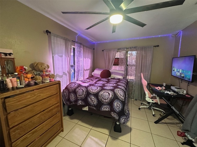 bedroom featuring light tile patterned floors and a ceiling fan