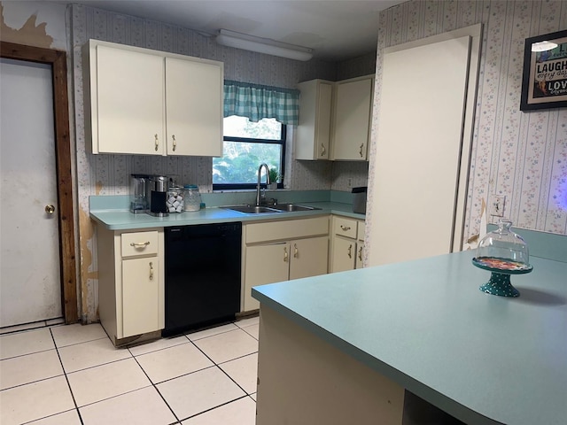 kitchen with black dishwasher, light countertops, light tile patterned flooring, a sink, and wallpapered walls