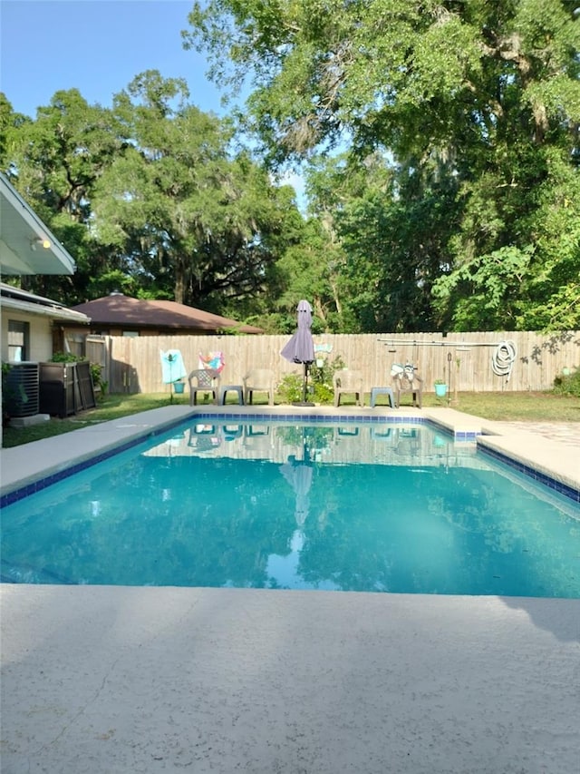 view of swimming pool featuring a fenced backyard and a fenced in pool