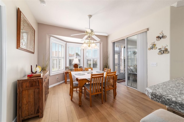 dining area featuring light wood finished floors, ceiling fan, and baseboards