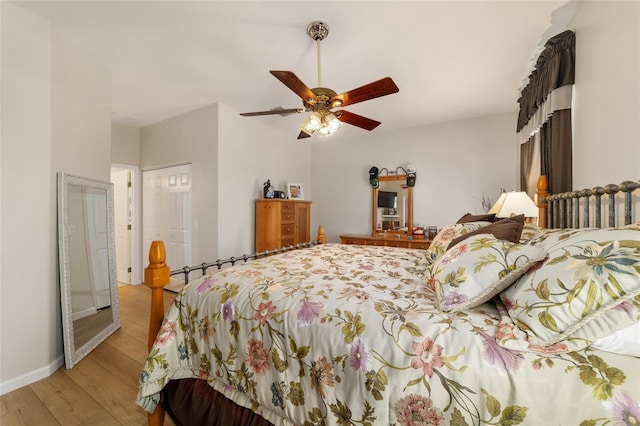 bedroom with baseboards, a closet, a ceiling fan, and light wood-style floors