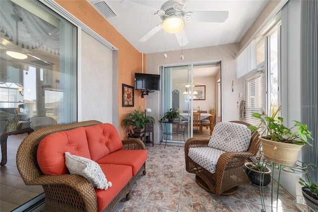 interior space featuring visible vents and a ceiling fan