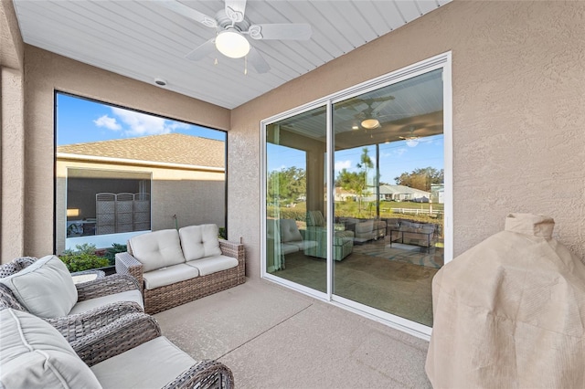 sunroom with ceiling fan and a wealth of natural light