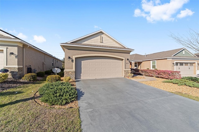 ranch-style house featuring a garage, stone siding, driveway, and stucco siding