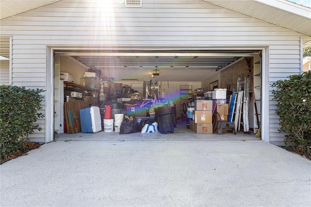 garage featuring driveway