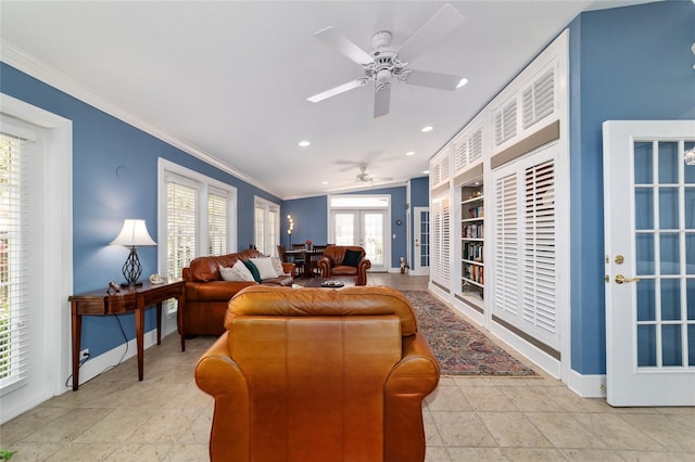 living area featuring baseboards, ceiling fan, crown molding, french doors, and recessed lighting