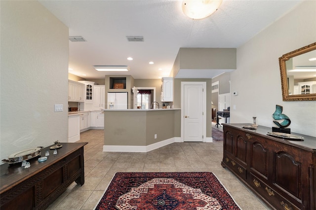 entrance foyer featuring light tile patterned floors, visible vents, baseboards, and recessed lighting