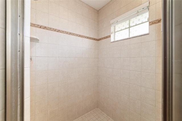 full bath with tiled shower