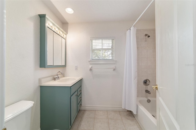 bathroom with toilet, vanity, baseboards, tile patterned floors, and shower / bathtub combination with curtain