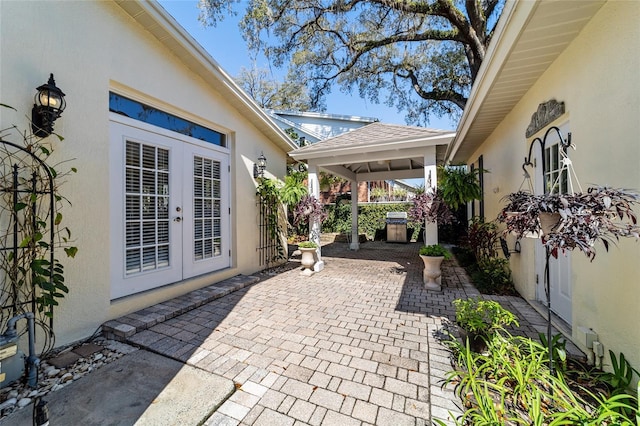 view of patio / terrace featuring french doors and a grill