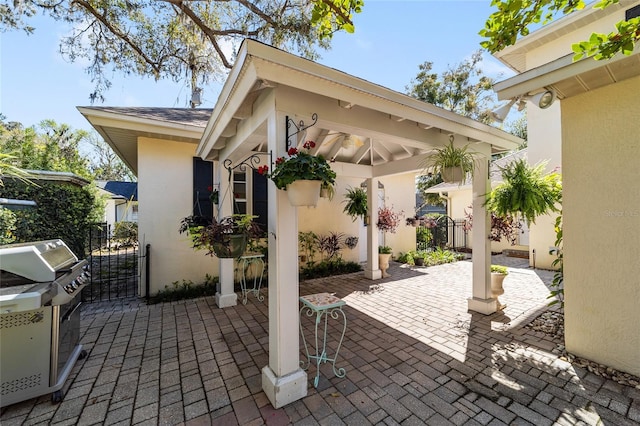 view of patio / terrace featuring a gazebo and fence