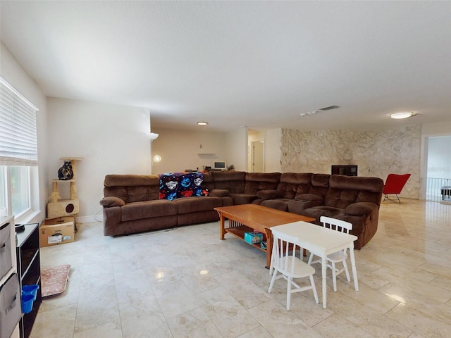 living room featuring visible vents