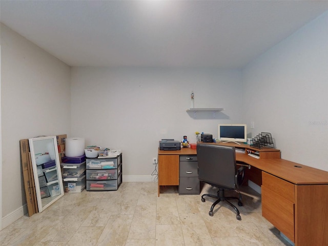 office area featuring baseboards