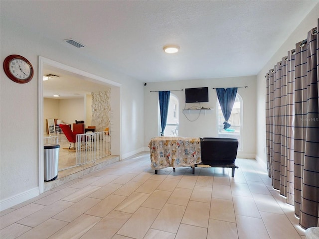 living area featuring visible vents and baseboards