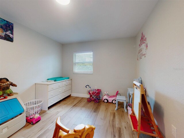 game room featuring light wood-style flooring