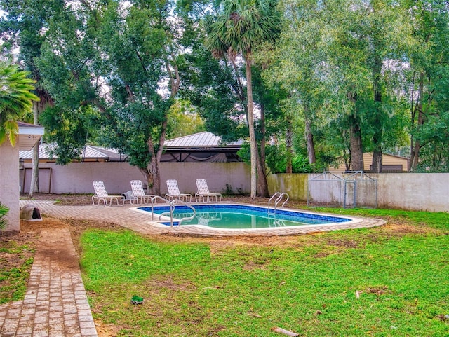 view of swimming pool featuring a fenced in pool, a lawn, a fenced backyard, a gazebo, and a patio area