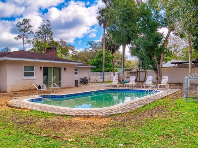 view of pool featuring a patio, fence, and a fenced in pool