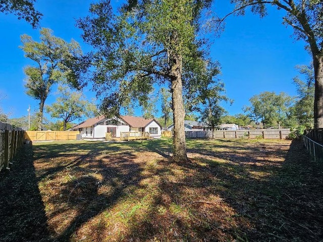 view of yard featuring a fenced backyard