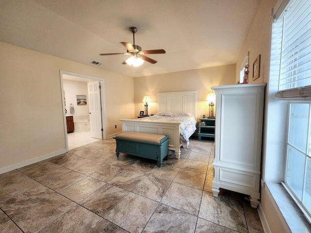 bedroom with connected bathroom, visible vents, ceiling fan, and baseboards