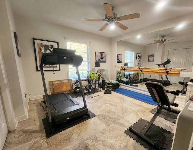 workout room featuring a wealth of natural light and baseboards