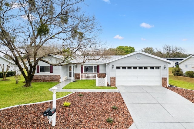 ranch-style home featuring brick siding, a porch, concrete driveway, an attached garage, and a front yard