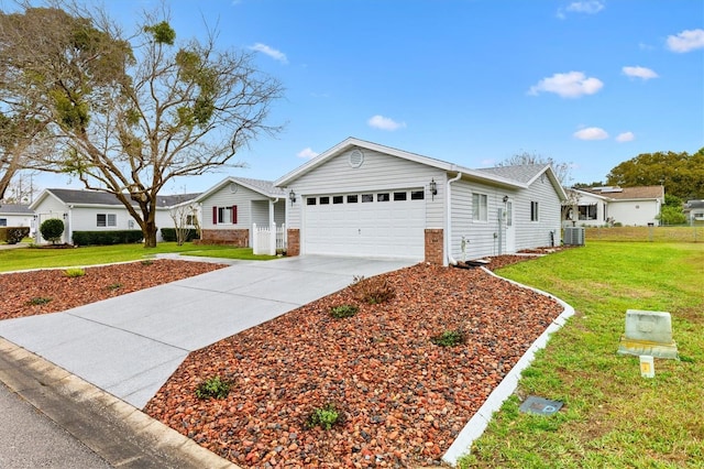 ranch-style home featuring a garage, a residential view, concrete driveway, and a front lawn