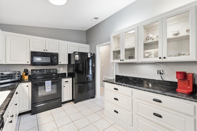 kitchen featuring visible vents, black appliances, glass insert cabinets, and white cabinetry