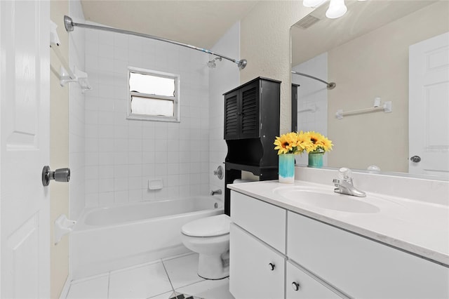 bathroom featuring tile patterned flooring, toilet, visible vents, vanity, and shower / washtub combination