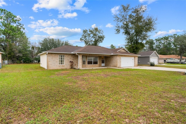 single story home with driveway, brick siding, an attached garage, and a front yard