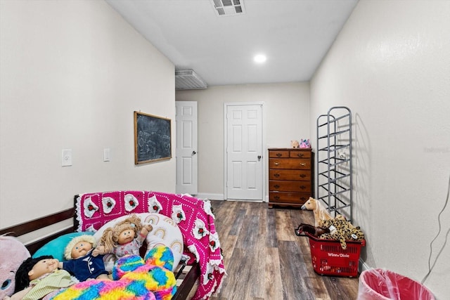 bedroom featuring dark wood-style floors, baseboards, and visible vents