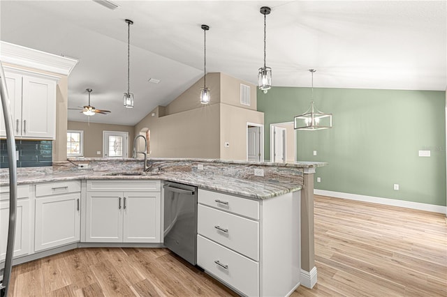 kitchen featuring dishwasher, hanging light fixtures, a sink, and white cabinetry