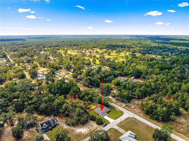 drone / aerial view featuring a forest view