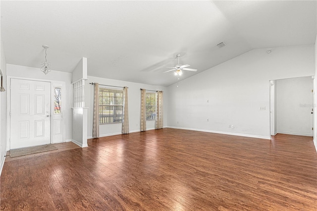 unfurnished living room with baseboards, visible vents, a ceiling fan, lofted ceiling, and dark wood-style floors