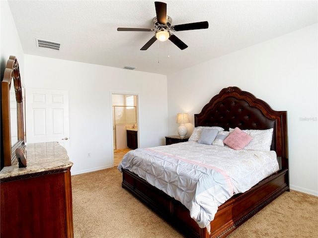 bedroom with light carpet, baseboards, and visible vents