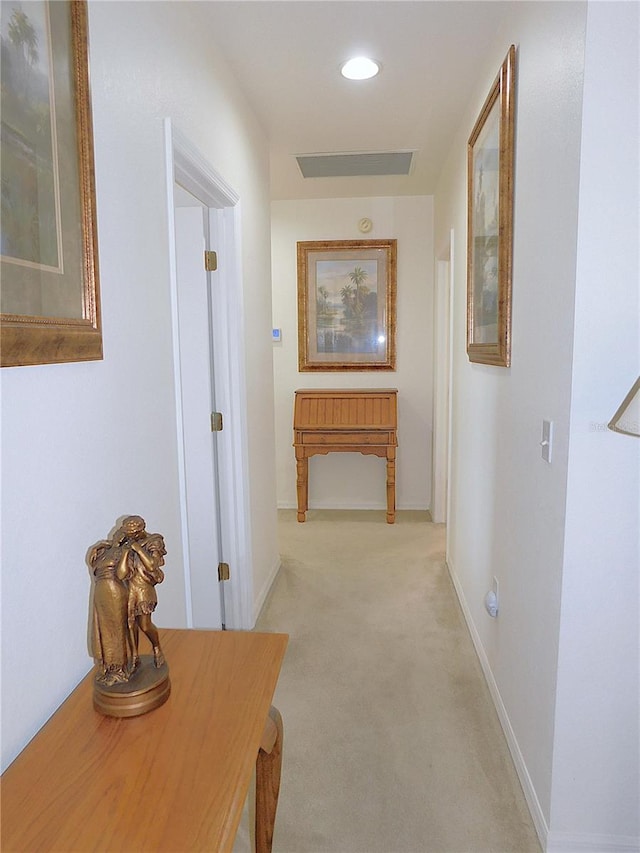 corridor with recessed lighting, light colored carpet, visible vents, and baseboards