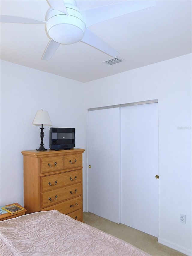 bedroom with visible vents and a closet