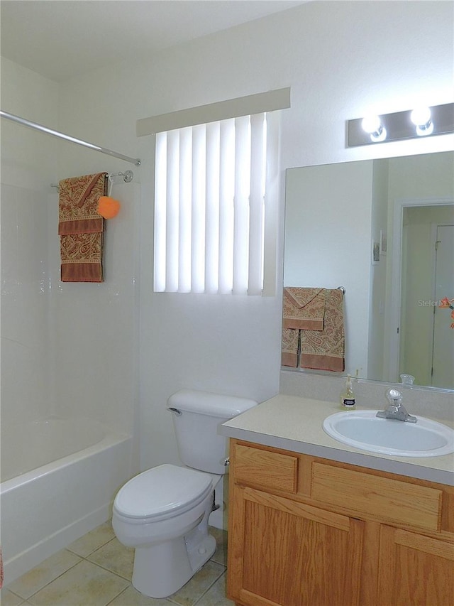 full bath featuring vanity, bathing tub / shower combination, tile patterned flooring, and toilet