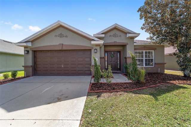 view of front of house with driveway, a garage, and stucco siding