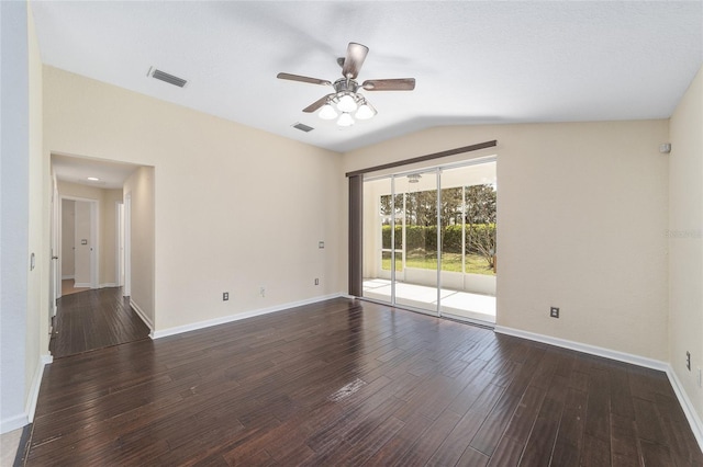 unfurnished room with lofted ceiling, wood finished floors, and visible vents