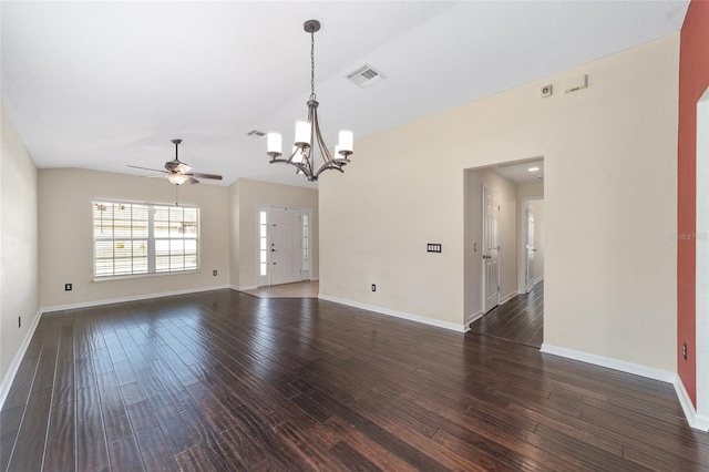 empty room featuring dark wood-style floors, visible vents, and baseboards