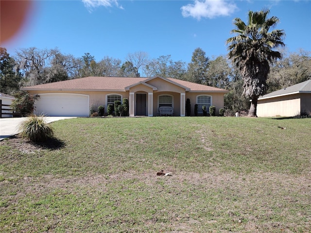 ranch-style home with a garage, a front lawn, and stucco siding