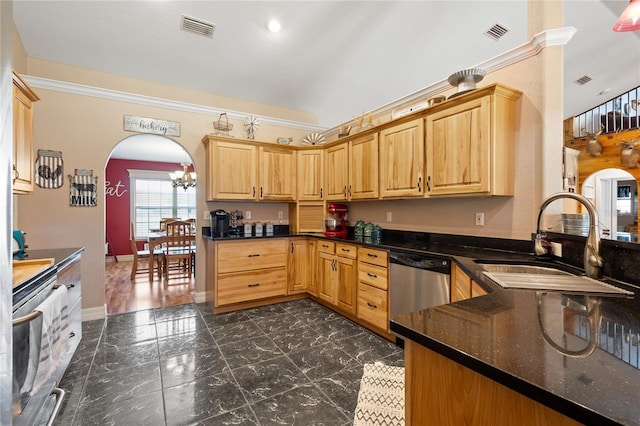 kitchen featuring visible vents, arched walkways, a sink, and oven