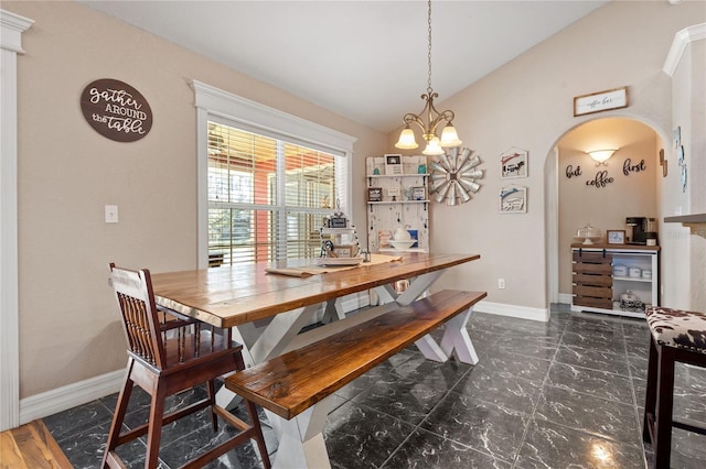 dining area with arched walkways, marble finish floor, vaulted ceiling, a chandelier, and baseboards