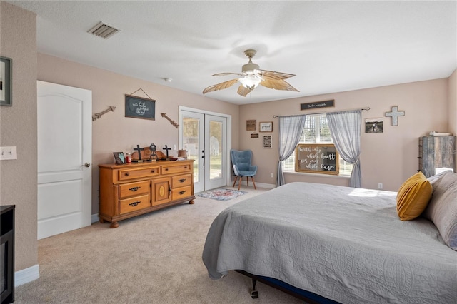 bedroom featuring light colored carpet, visible vents, baseboards, access to exterior, and french doors