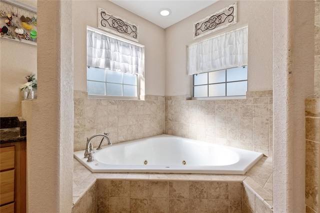 full bathroom featuring a jetted tub