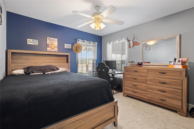 bedroom with light carpet and ceiling fan