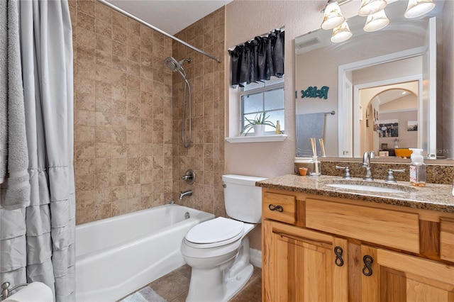 full bath with shower / tub combo with curtain, visible vents, toilet, vanity, and tile patterned flooring