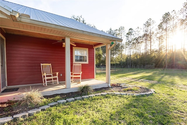 exterior space featuring ceiling fan